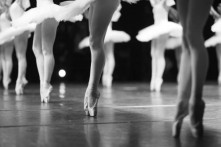 Graceful ballerinas feet dancing on pointe on stage during a performance